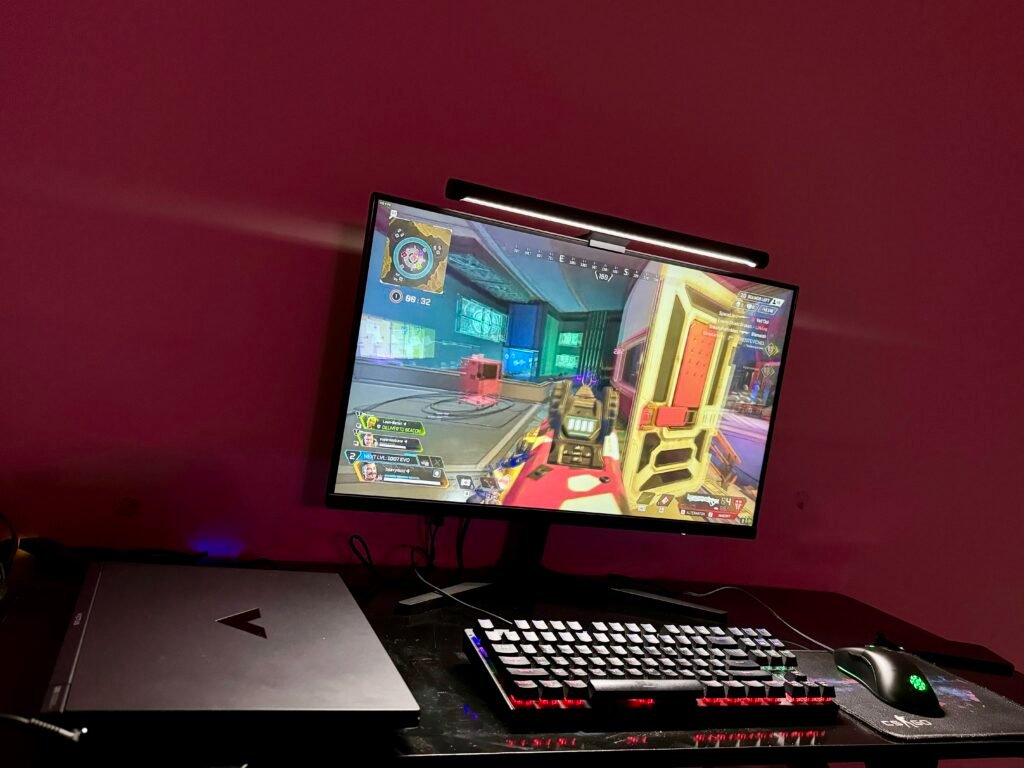 Playing apex legends on gaming laptop while connected with a external computer. Gaming keyboard and mouse.